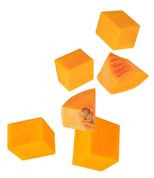 istock Flying Pumpkin pieces isolated on white. Pumpkin Explosion. Levitating  Pumpkin pieces withseeds. Top view. Flat lay  2246017663