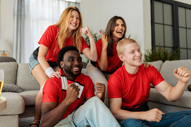 istock Friends Celebrating and Having Fun While Watching Sports Match 2246018701