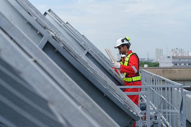 istock Two construction engineers inspect a cooling tower system in an industrial area. They focus on the complex process of dismantling the cooling system as part of a necessary maintenance job. 2246019224