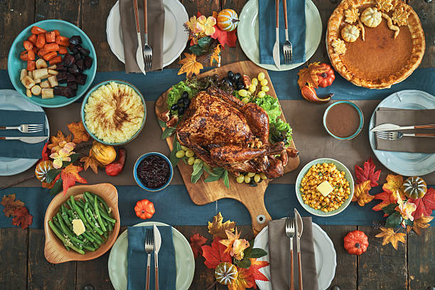 istock Having Stuffed Turkey for Thanksgiving Holiday Dinner with Vegetables and Gravy 2246020891