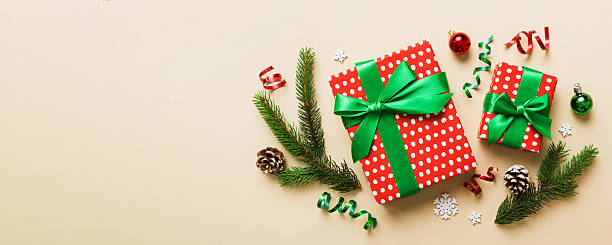 istock Top view Flat lay Christmas decorations and gift box on colored background with copy space. Christmas or Happy New Year composition 2246021440