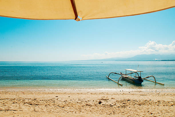 Fisherman and boat in the sea