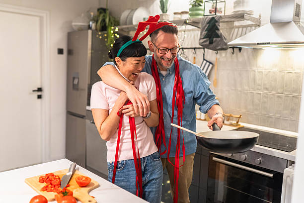 Mature couple preparing their Christmas meal in a modern kitchen