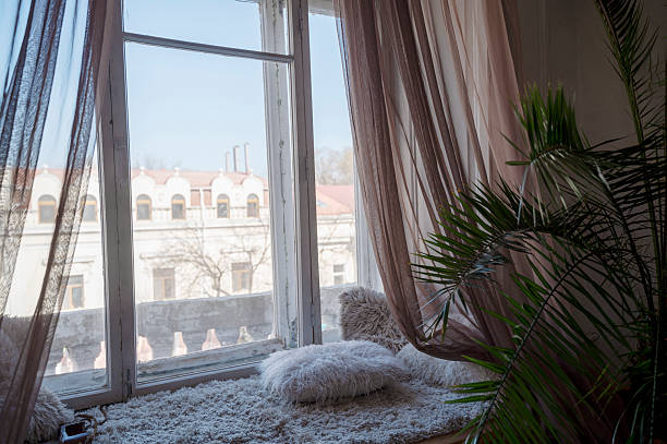 istock Window Seat with a view to the yard and large windows 2246026283