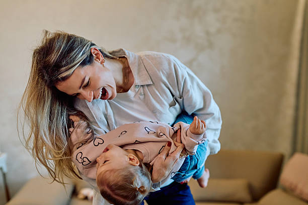 istock Mother playing with baby, laughing and having fun 2246036925