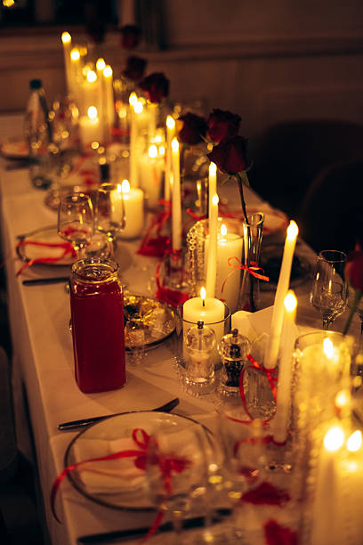istock Warm candlelit banquet table with roses and crystal decor in restaurant 2246038181