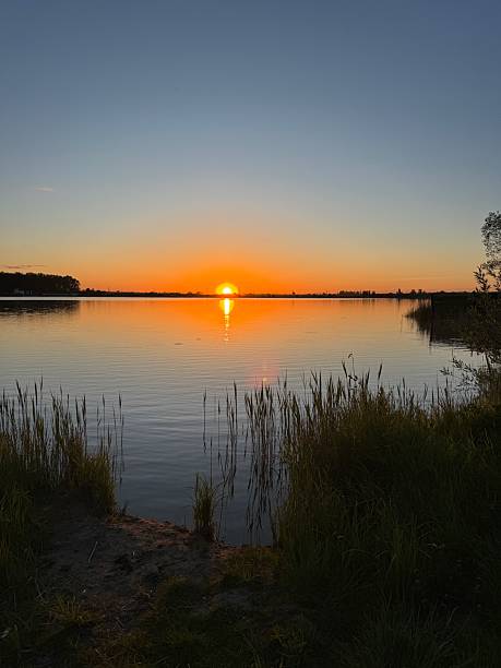 istock Golden Sunset over Quiet Lake 2246038407