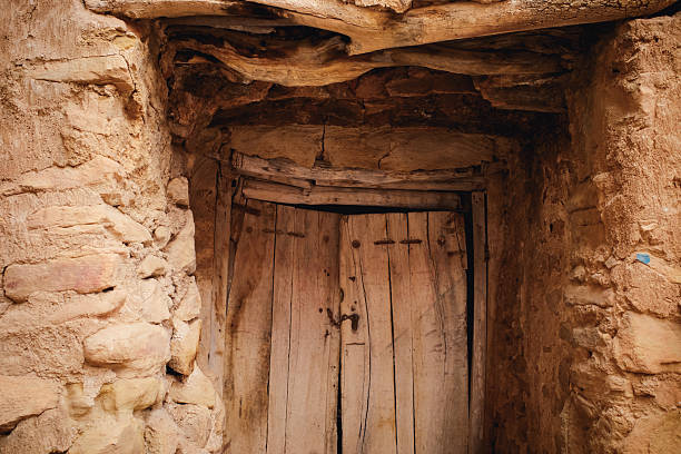 istock Rustic Wooden Door in Stone Wall 2246038872