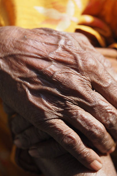 istock Elderly hands showing life's stories and experiences 2246039887