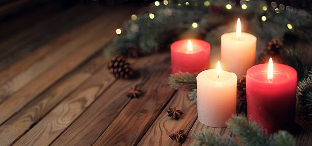 istock Candles on a rustic wooden table, Christmas mood 2246040010