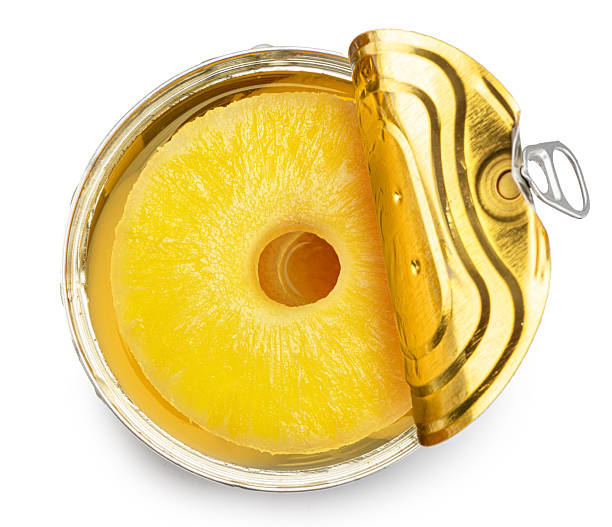 istock Pineapple rings in a tin can isolated on white background. Clipping path 2246045626