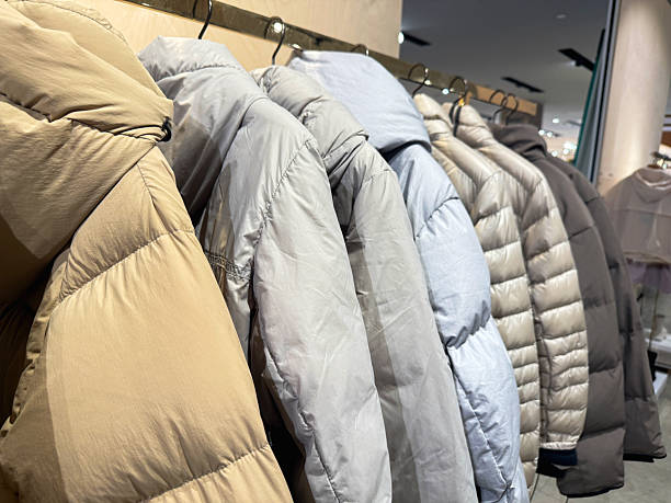 istock New season down jackets hanging in row 2246046627