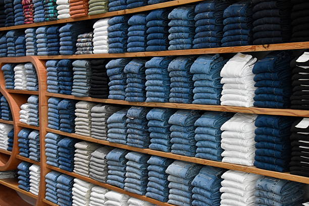 istock A visually striking display of designer jeans, neatly aligned in uniform columns, ideal for fashion or retail themes. 2246048488