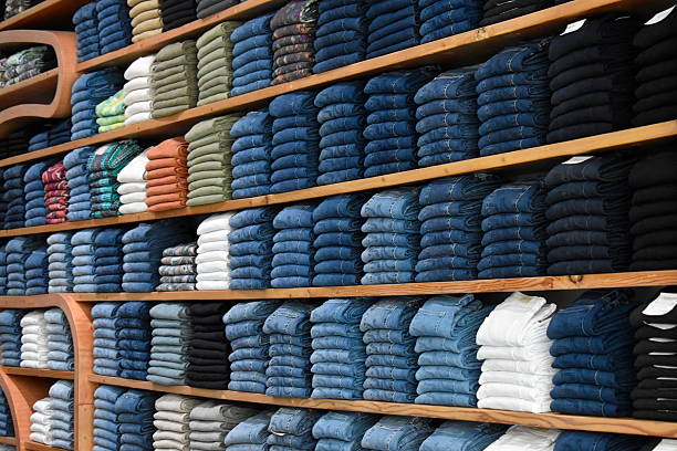 A visually striking display of designer jeans, neatly aligned in uniform columns, ideal for fashion or retail themes.