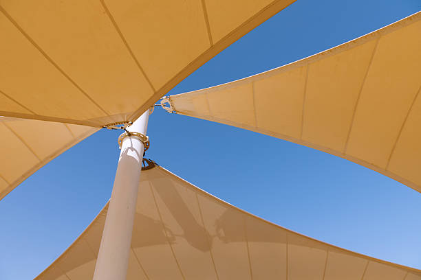 istock The yellow canopy is photographed against a blue sky background 2246049389
