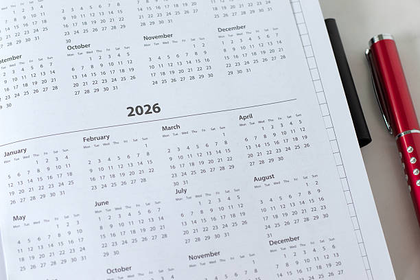 istock 2026 calendar year in notebook planner with pen 2246053241