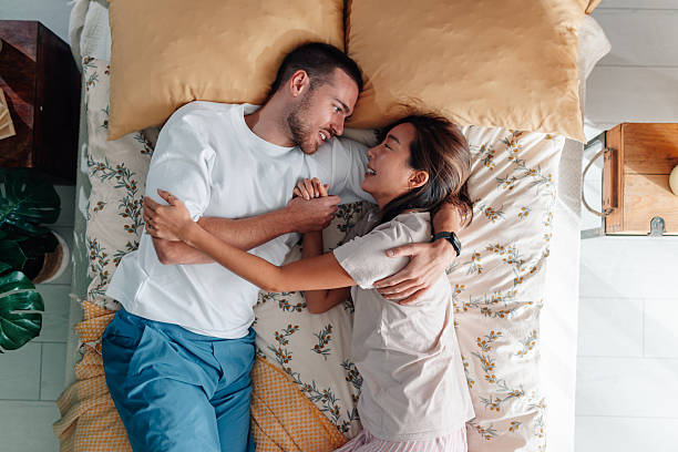 istock Young couple hugging in bed showing affection and bonding 2246054280