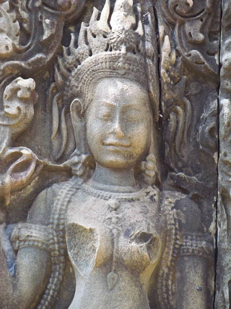 Portrait of stone Naga Man, an Asura, or Hindu Deity Life Sized Ancient Carved Stone found near Siem Reap Cambodia in Hindu Temple.