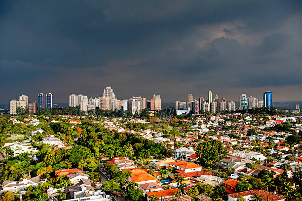 Iin the outskirts of Sao Paulo and near the town of Barueri in the background, lies Alphaville with its residential houses, tall buildings and condominiums