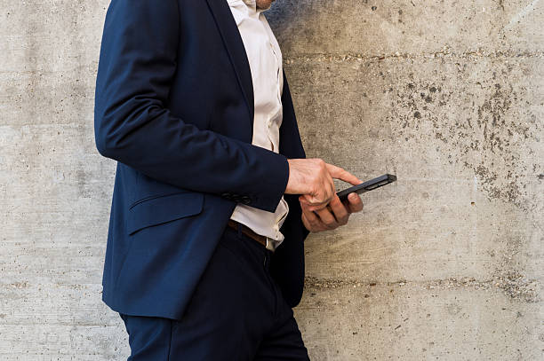 istock Interacting with Business App on Phone 2246055876