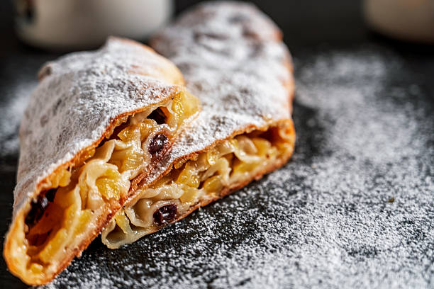 Homemade apple strudel on white marble background