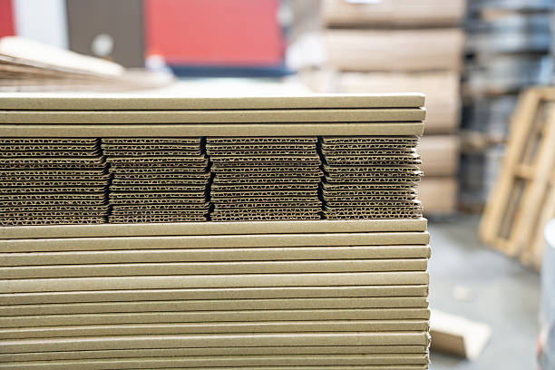 istock Stacks of Flat Corrugated paper boxes for shipping 2246059284