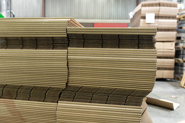 istock Stacks of Flat Corrugated paper boxes for shipping 2246059290