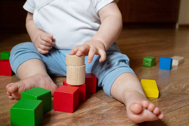 istock Child Playing with Eco-Friendly Wooden Blocks 2246061178
