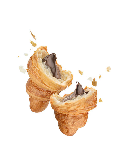 istock Halves of croissant with chocolate on white isolated background, falling 2246061639