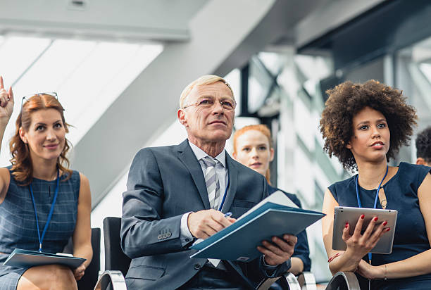 istock Engaged Business Executives Participating in Lively Conference Session 2246061848