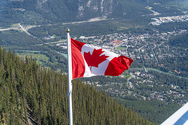 istock The Canadian Maple Leaf flag flying over Banff Alberta 2246063973