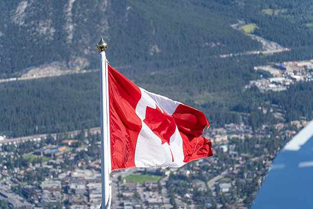 istock The Canadian Maple Leaf flag flying over Banff Alberta 2246063976