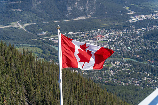 istock The Canadian Maple Leaf flag flying over Banff Alberta 2246063983