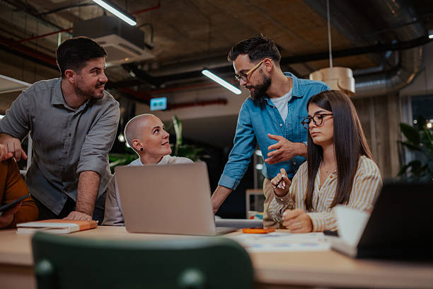 istock Business team collaborating on project in modern office 2246064389