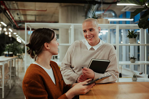 istock Women colleagues collaborating during casual office meeting 2246064672
