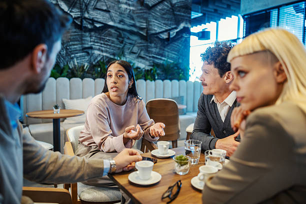 istock Diverse business colleagues discussing ideas in coffee shop 2246065585