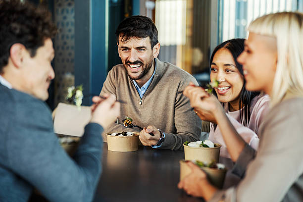 istock Diverse colleagues enjoying lunch break, laughing and talking 2246065779