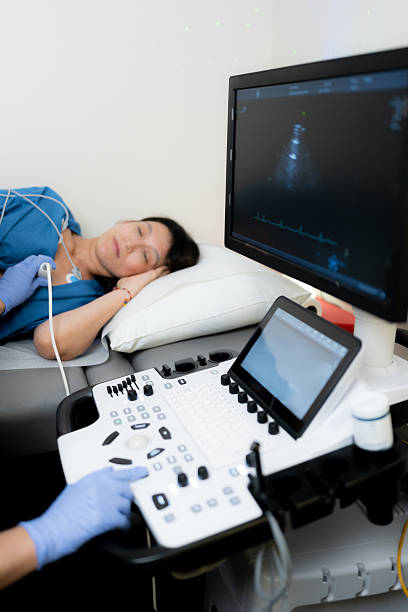 istock Patient undergoing echocardiogram with medical ultrasound equipment 2246066373