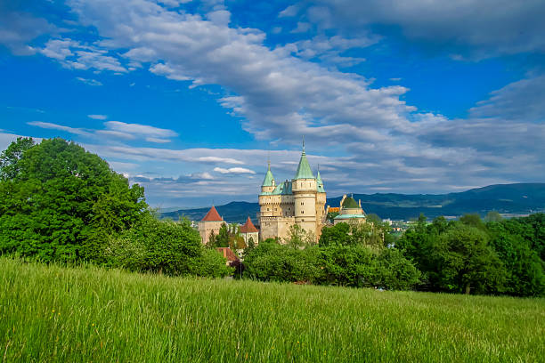 Bojnice, Slovakia - 05 May 2015: Bojnice Castle exterior towers and walls in landscape. Medieval Romanesque castle with some original Gothic and Renaissance elements built in the 12th century. Bojnice zamok