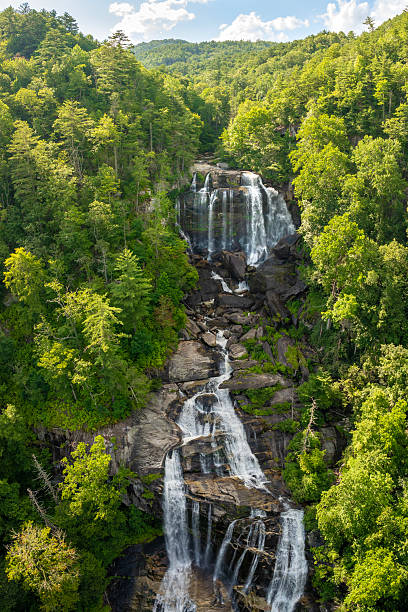 istock Whitewater Falls with falling down clear water from rocky boulders between green lush woods in Nantahala National Forest, North Carolina, USA 2246068298