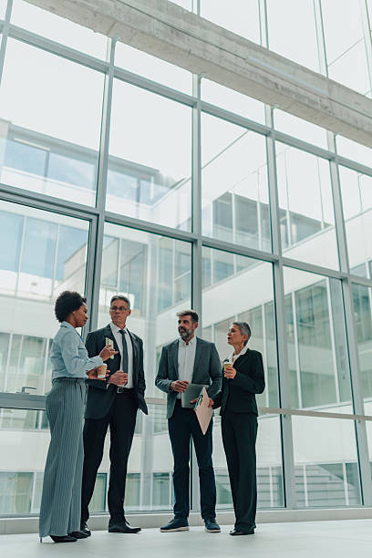 istock Business people having informal coffee break meeting in office 2246069720
