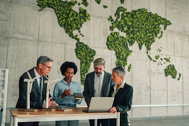 istock Business people planning renewable energy solutions with world map 2246070490
