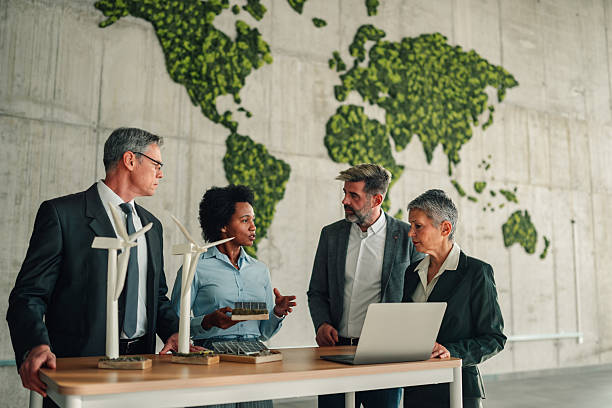 istock Business people discussing renewable energy models in a meeting 2246070546