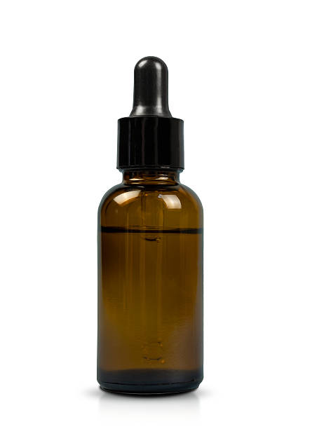 istock serum bottle with pipette showcasing elegance, stylish white background highlighting cosmetic serum with dropper tool, chic glass serum dispenser featuring pipette in minimalist cosmetic 2246074045
