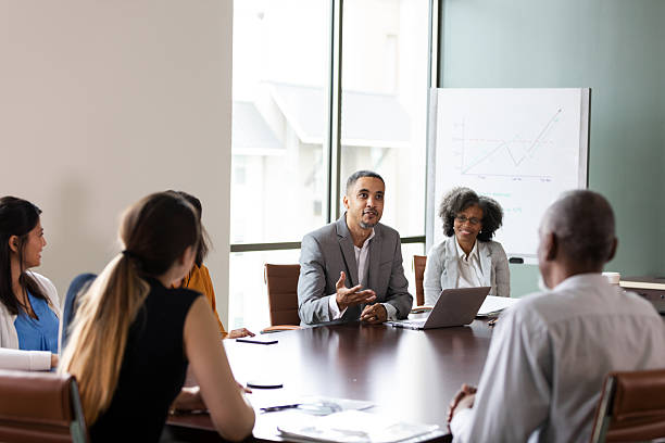 istock Diverse business professionals collaborating in a modern meeting room, discussing strategy. 2246074159