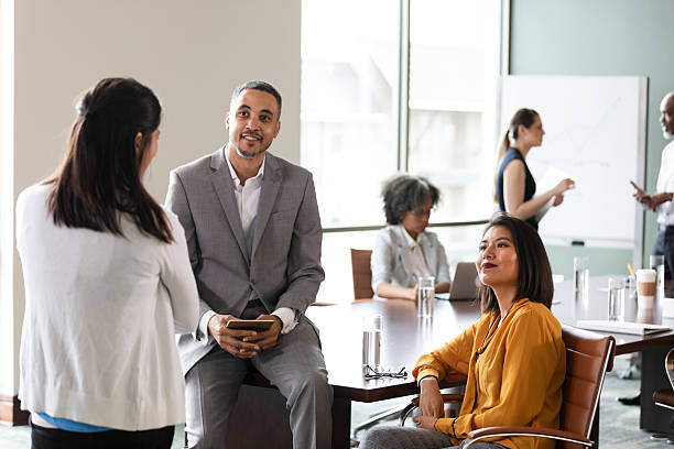 istock Diverse professionals collaborating in a modern office meeting, discussing ideas and working together 2246074163