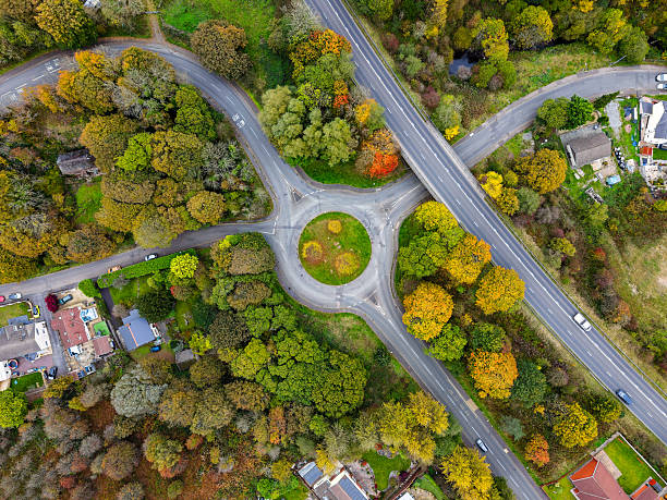 istock Top-Down Drone Shot of Traffic Circle and Autumn Trees 2246076136