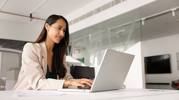 istock Beautiful young executive woman working on company online project 2246076692