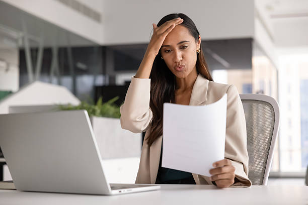 istock Concerned stressed young Maori accountant woman reading document 2246078104