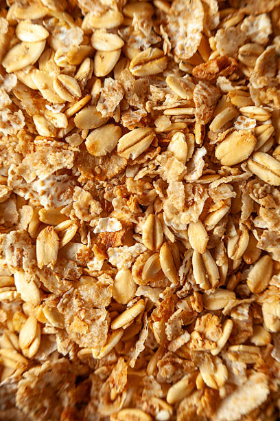 istock Oats and granola mix creating healthy breakfast background 2246078898